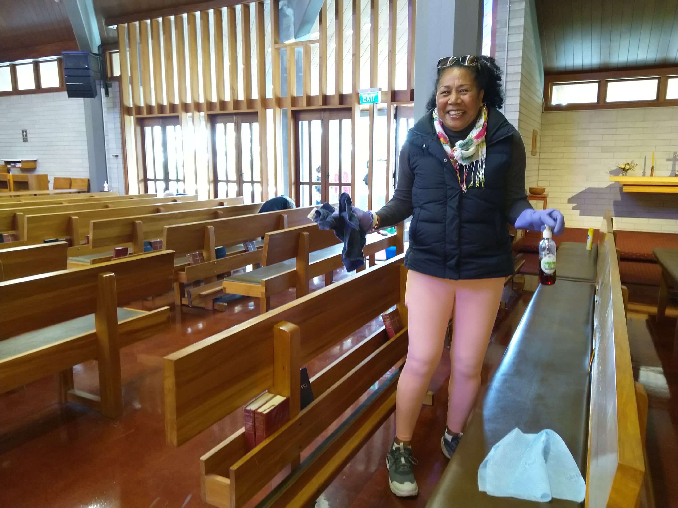 WB LT Lady cleaning church pew