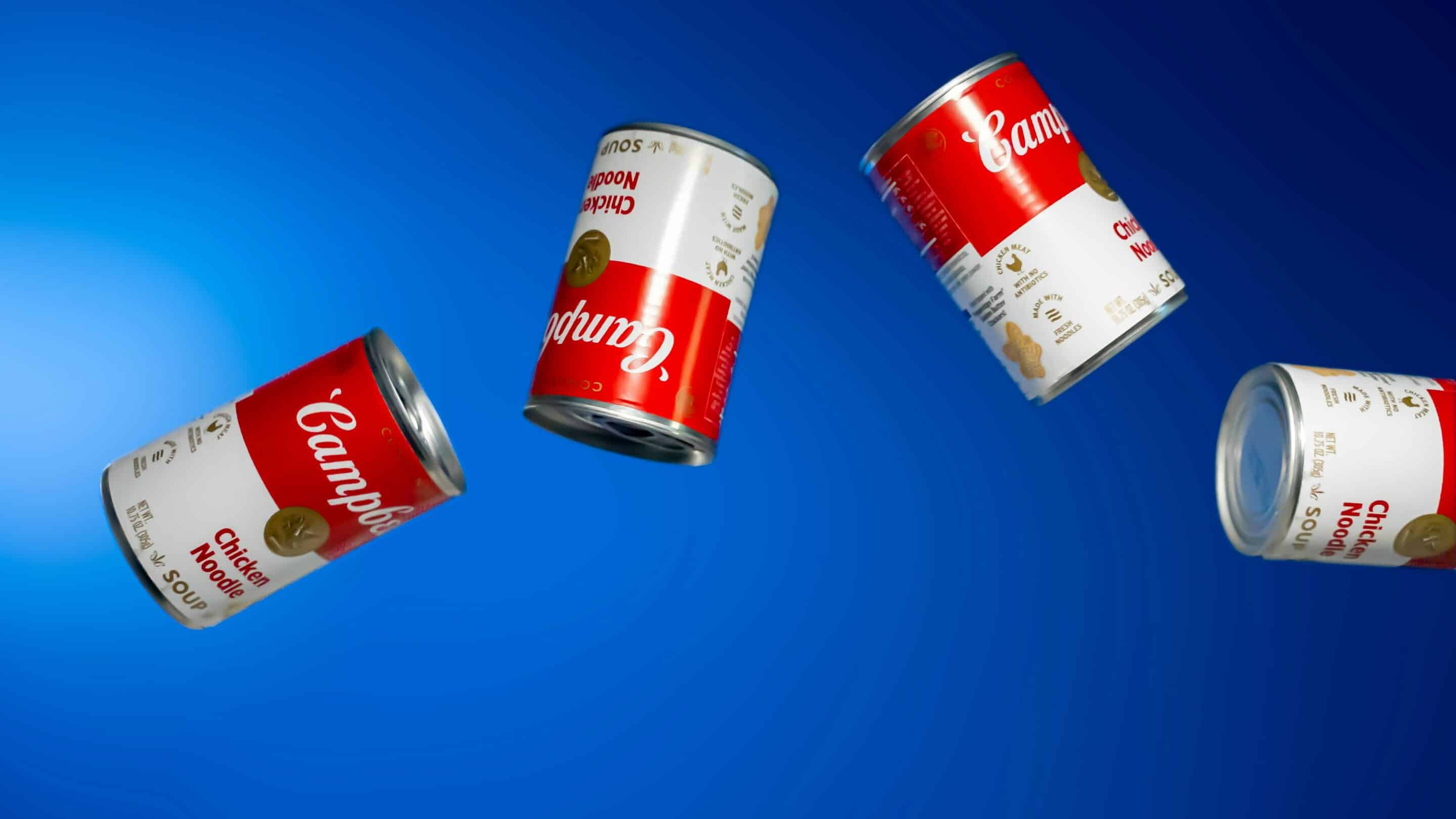 ben-lolli-hPBp8-xZWyA-unsplash Tins of soup on a blue background
